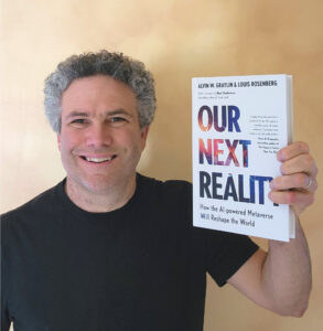 Rosenberg holding his new book, Our Next Reality from Hachette